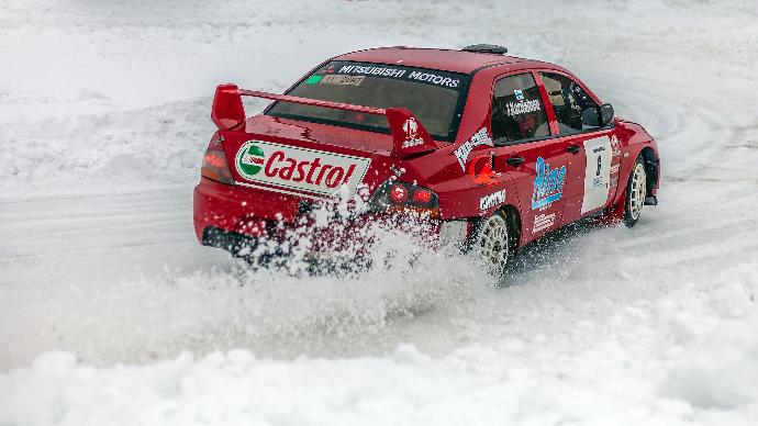 red racing car on snow field